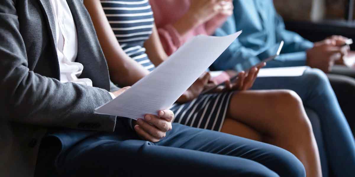 man reading a resume