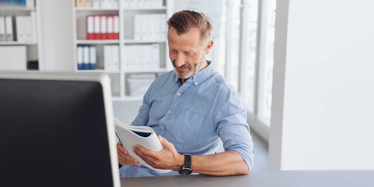 man reading a report